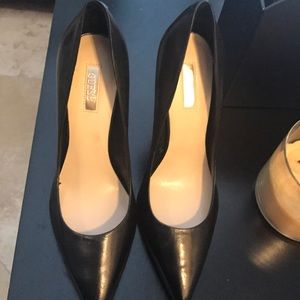 Black pointed toe gold heels